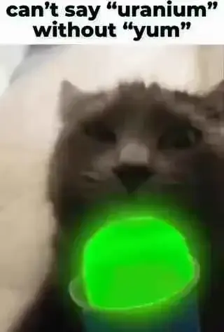 Picture of a cat with a glowing green ball captioned: "can't say 'uranium' without 'yum'"